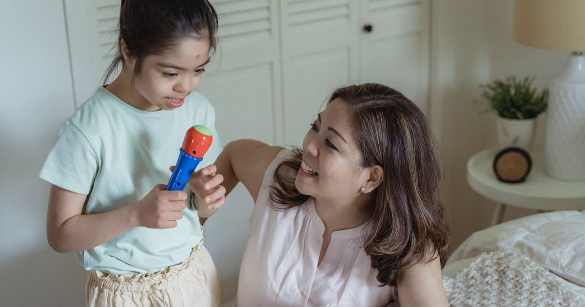 Mother and daughter play together, modeling healthy communication and respect in parent-child interactions.