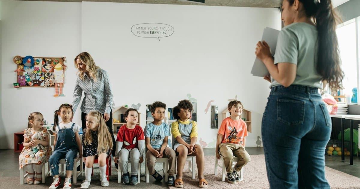 Preschool teachers and children in a classroom, illustrating the educators parents want to thank.